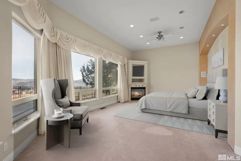 Living Room with stone fireplace and picturesque windows