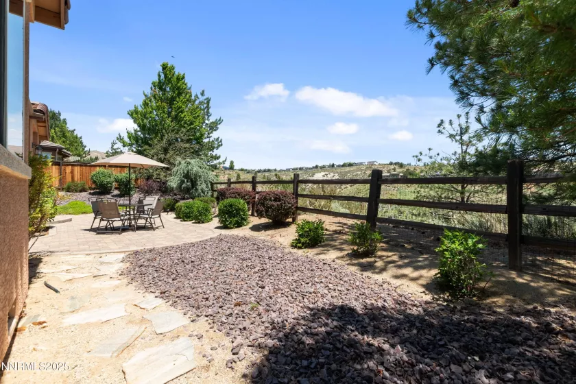 Large weather protected paver patio with golf course views!