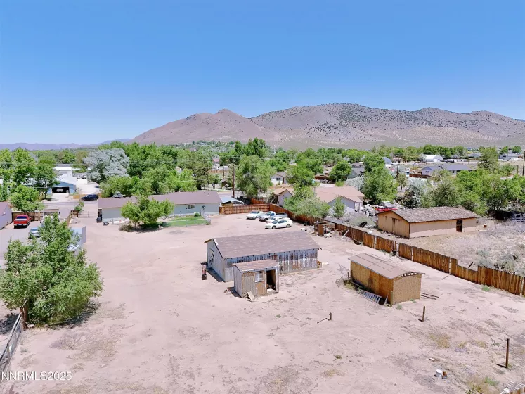 Overhead view of sheds and separate garage and backyard