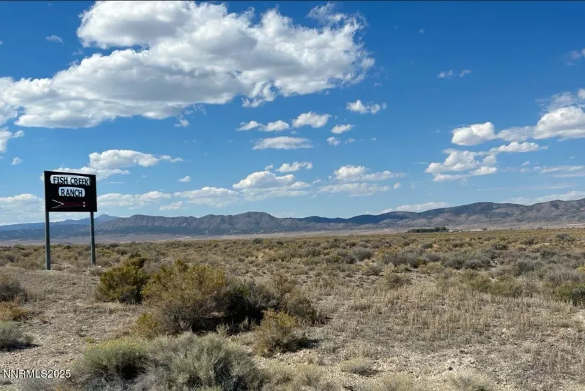 End of paved road and Fish Creek Ranch sign