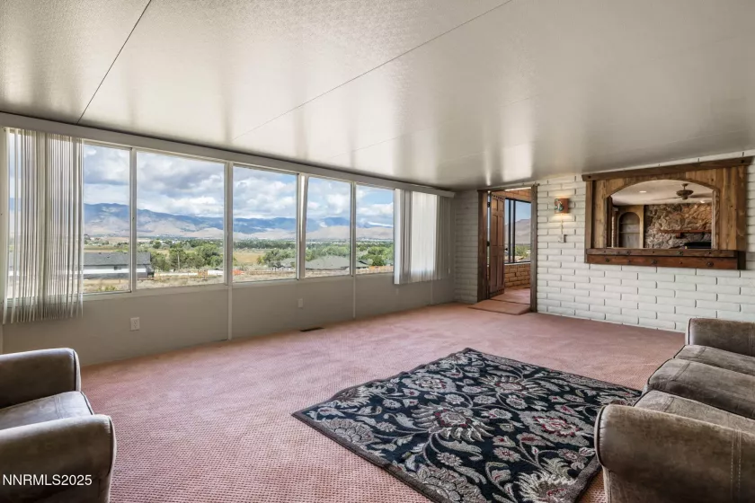 Pantry with large pull out shelves on right side and washer dryer on the left side.