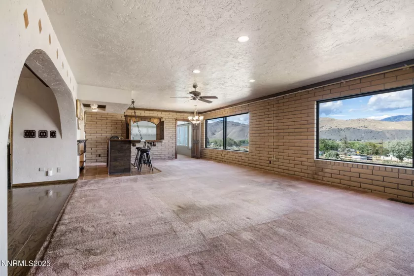 View of the great room from the rock fireplace.