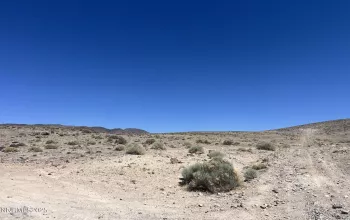 corner of Apache Dr. & Wildflower Rd. (looking up the hill at the parcel)