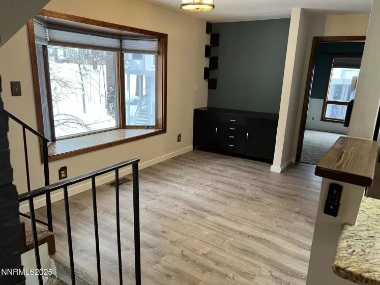 Dining Area with window seat and built in storage cabinet