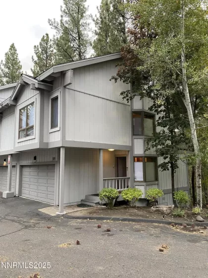 Exterior view of unit # 23 at Fairway Pines, with attached 2 car garage