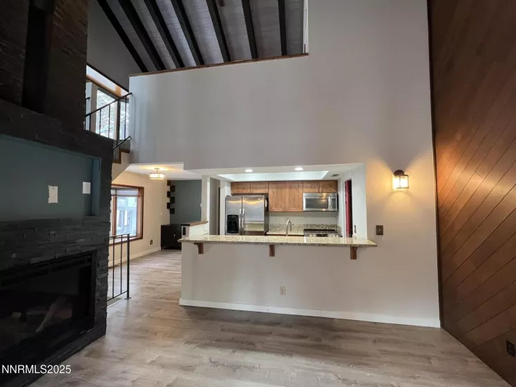 View from living/great room toward kitchen, dining and loft