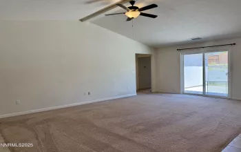Great Room w high ceilings and ceiling fan