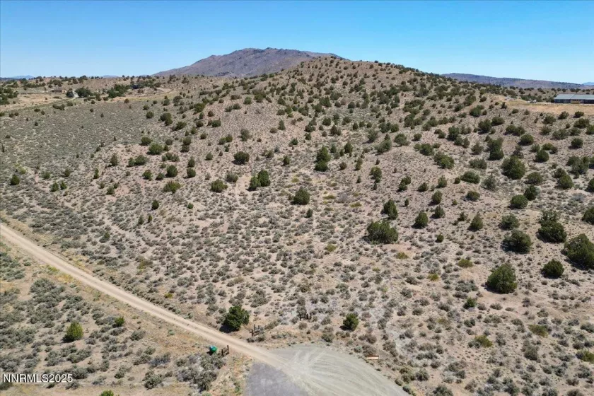 Possible well location marked by well witcher. North facing slope walking up to the Peak.
