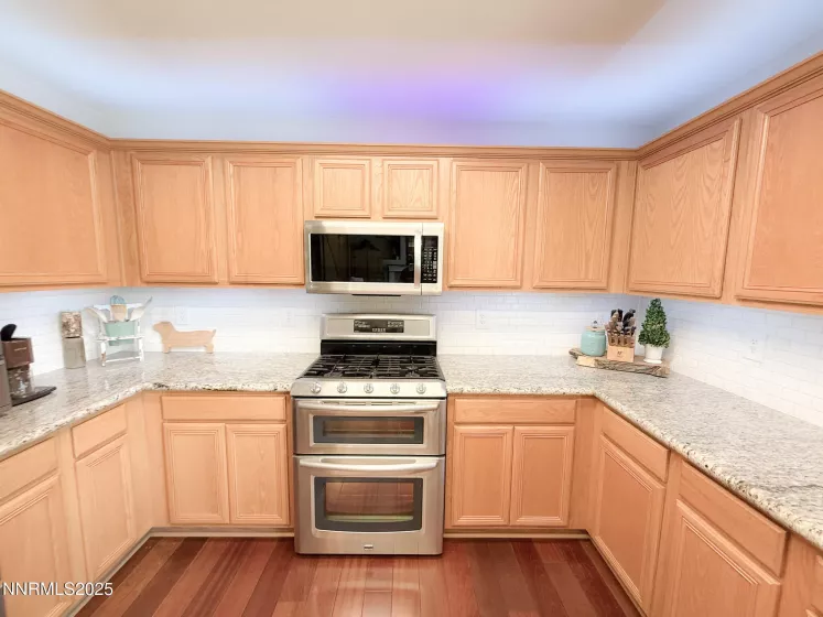 Newer Stainless Steel appliances including gas range and double oven