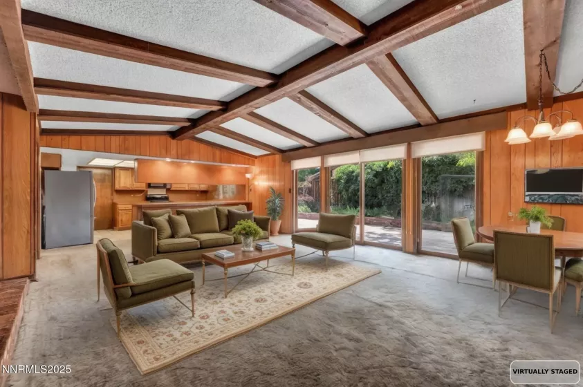 Great room with easy sliding door access to a spacious, private backyard patio.