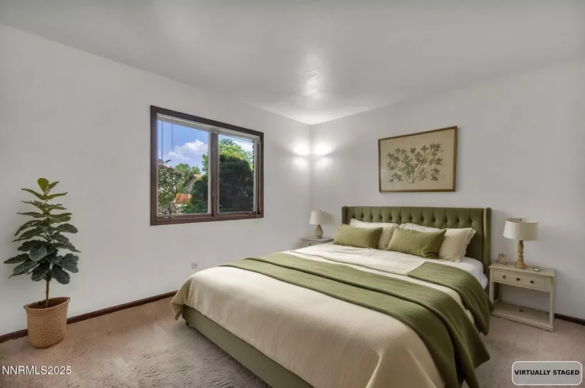 Guest bedroom 2 features spacious layout, abundant natural light, and ample closet space.