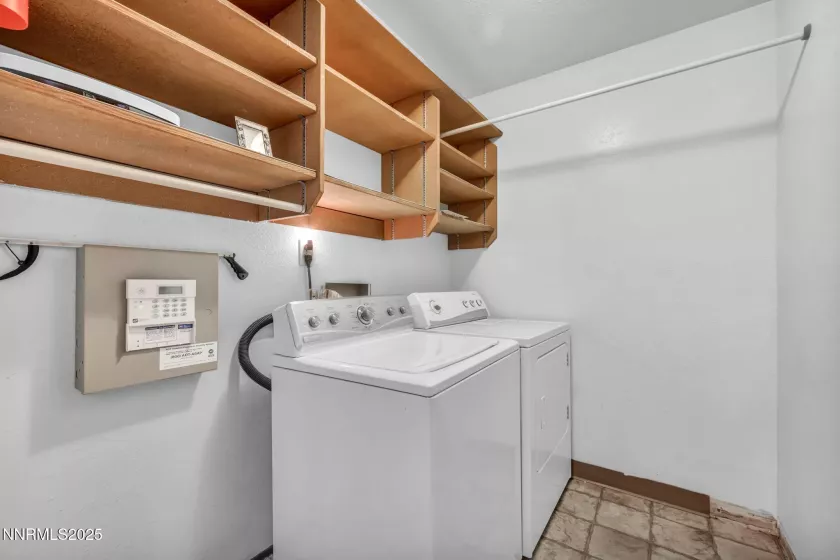 Spacious laundry room conveniently located in the central hallway for easy access and functionality.