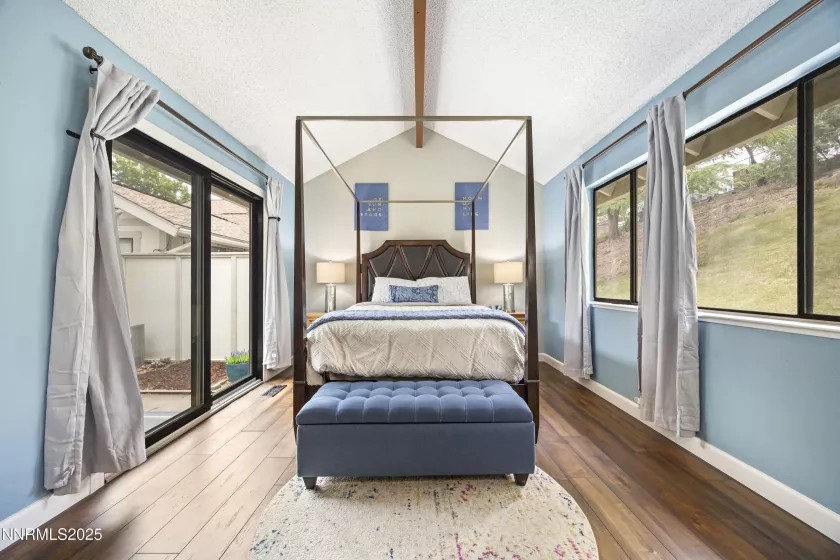Primary bedroom with slider to private patio courtyard