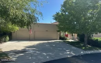 3 CAR FRONT VIEW. YARD MAINTAINED BY HOA
