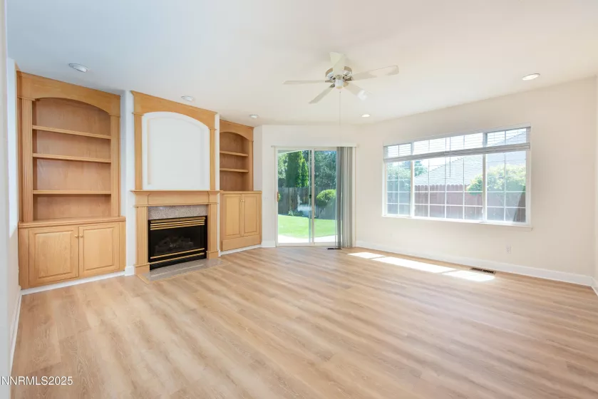 Great room with built in cabinets and fireplace