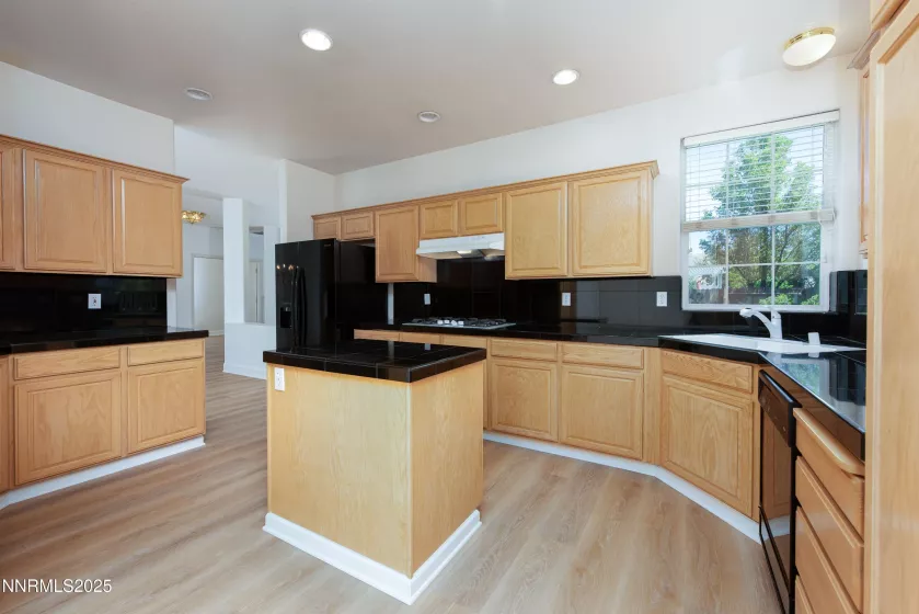 Kitchen with granite counters and island
