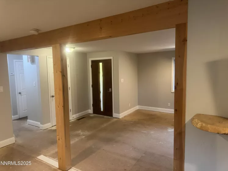 Wood wrapped beams at entryway