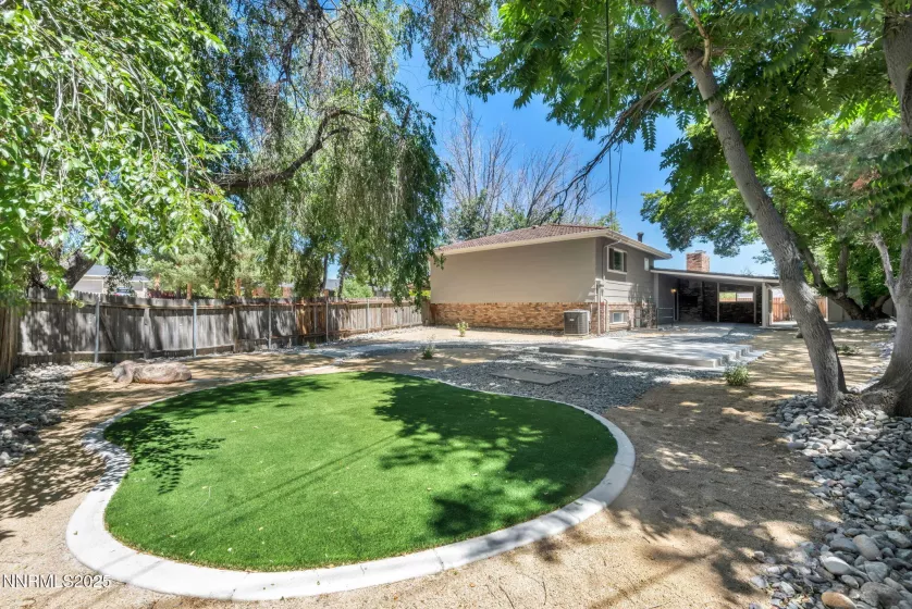 Backyard view of outdoor areas and covered patio