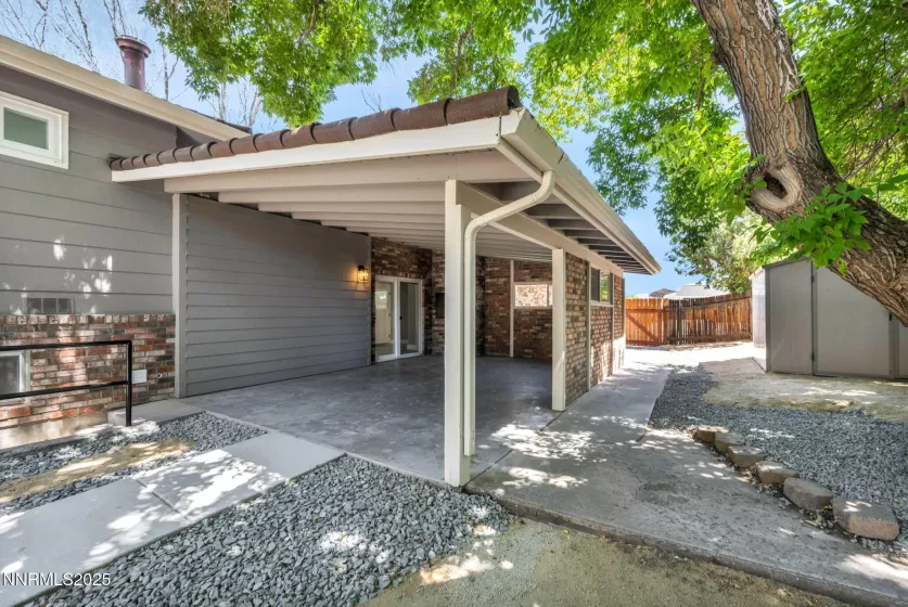 Back covered patio, walkway to side yard parking and storage