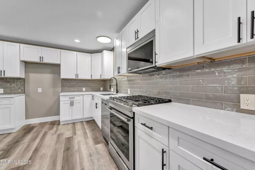 Walking into kitchen from front entrance area