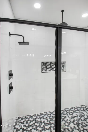 Primary Oversized Walk In Shower with Niche and Upgraded Rainhead