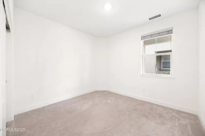 Well-sized bedroom ideal for kids, guests, or home office