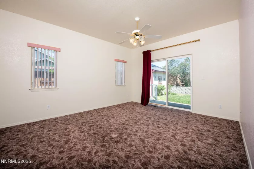 Primary bedroom with slider out to patio
