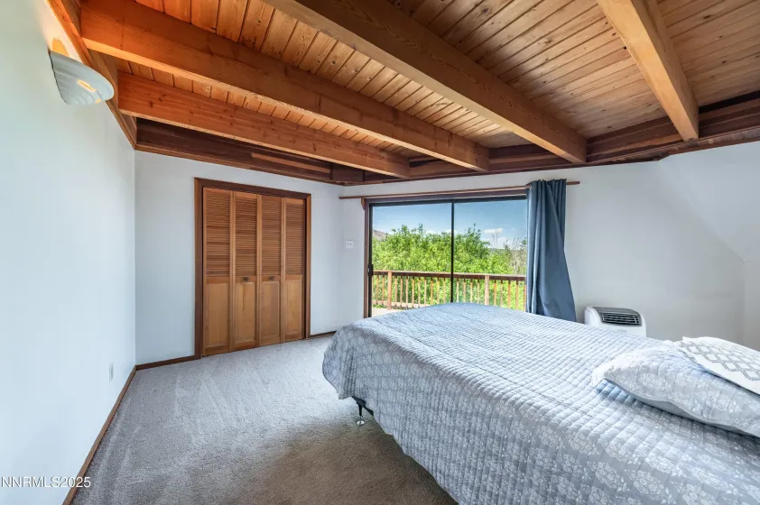 guest bedroom #1 Main east dome. Sliding glass opens to rear deck and Whites Creek