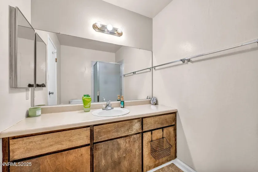 Primary Bathroom has walk in shower stall.