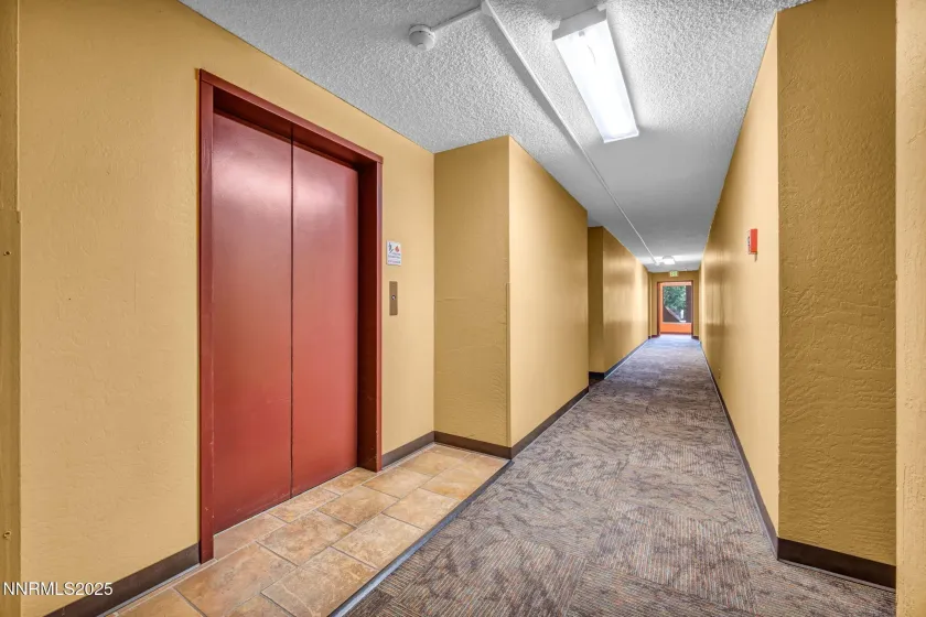 The elevator is located directly across the hall from the unit front door.