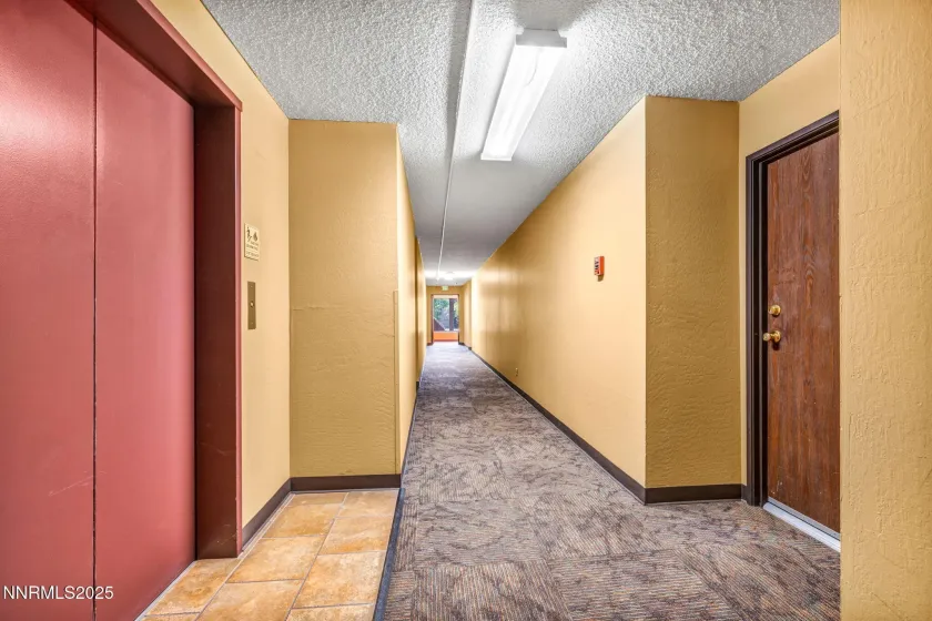 The elevator is located directly across the hall from the unit front door.