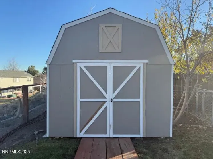 Large storage shed in rear yard