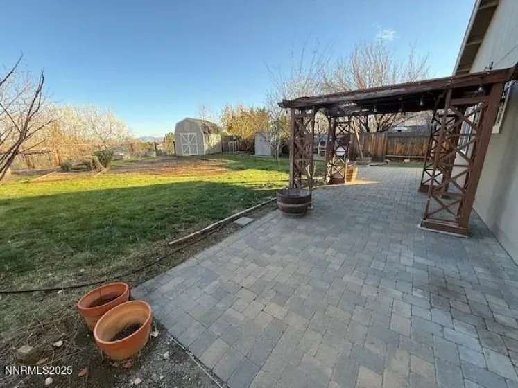 Year yard with patio and pergola