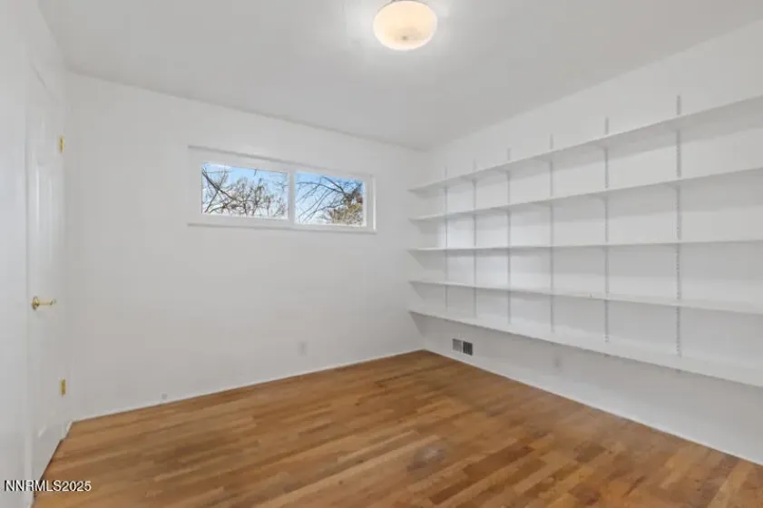 Middle bedroom with bookshelves