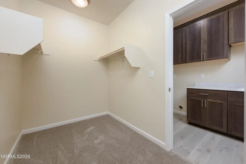 Primary Closet with access to Laundry Room