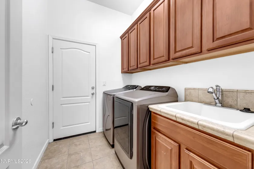 Laundry Room with Sink/Man Door to 3 car Garage