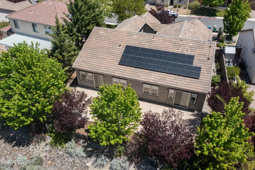 Back of house with paid off solar