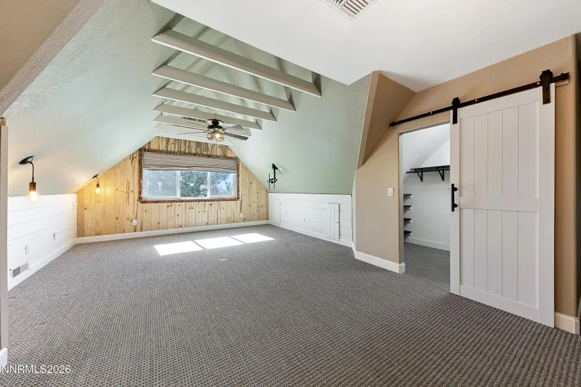 Primary bedroom with two walk in closets