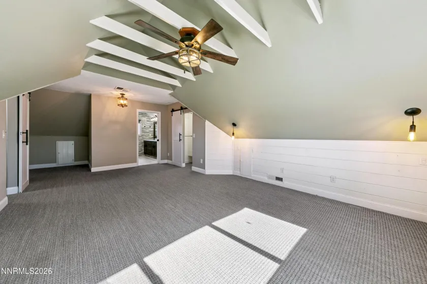Primary bedroom with ensuite bath and two walk in closets