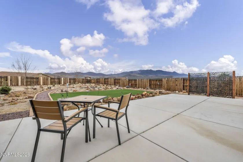 Large concrete patio in rear