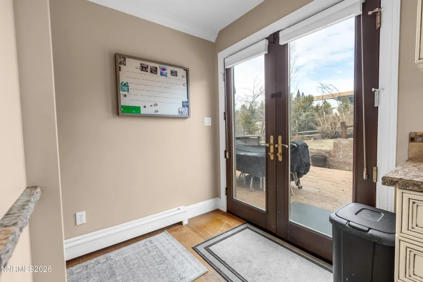 Double doors to outside deck by kitchen and wet bar