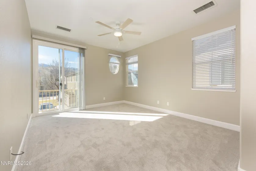 Primary bedroom with balcony