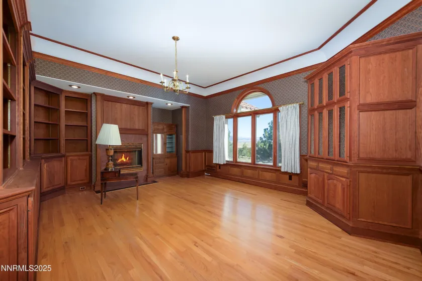 Library w/fireplace, cherry cabinets and sink