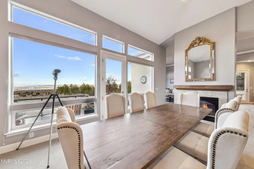 Formal dining area with fireplace.