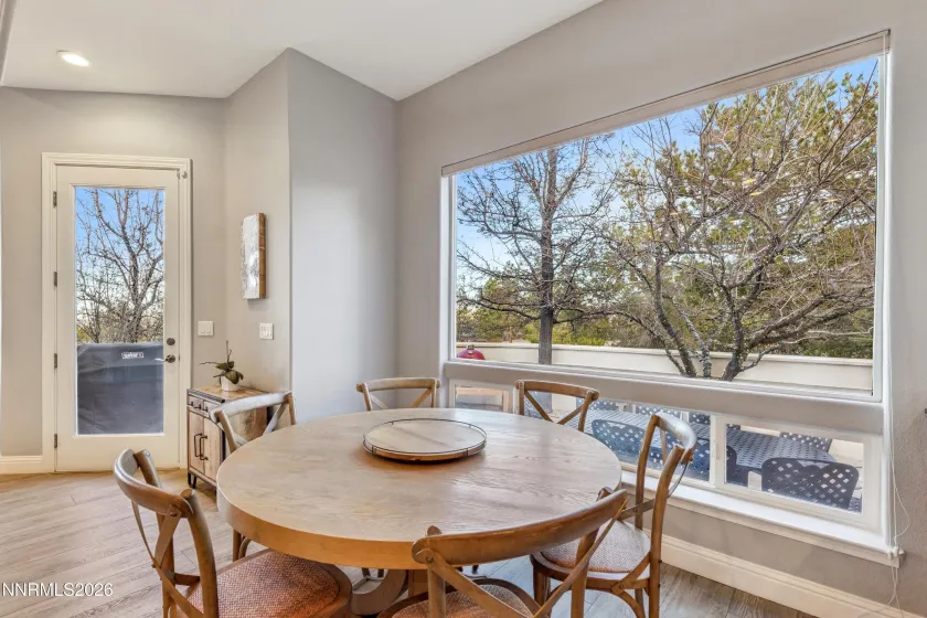 Breakfast nook and door to outdoor dining terrace.