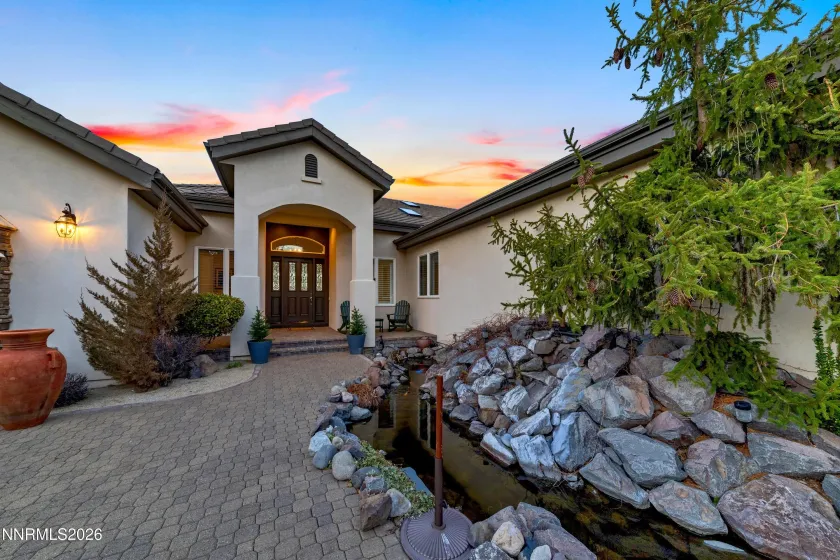 Entrance showing Koi Pond and waterfall feature.