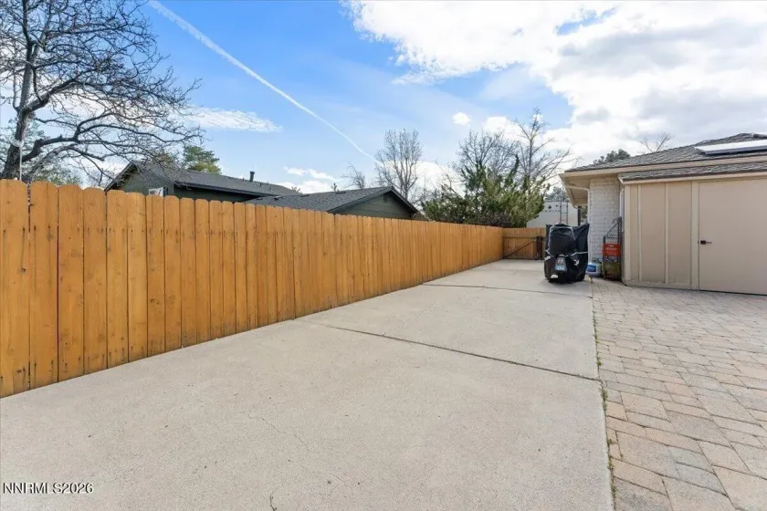 Concrete parking side of garage to backyard/basketball