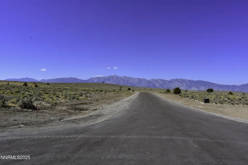 From the end of Veris court, Paved street and underground power.