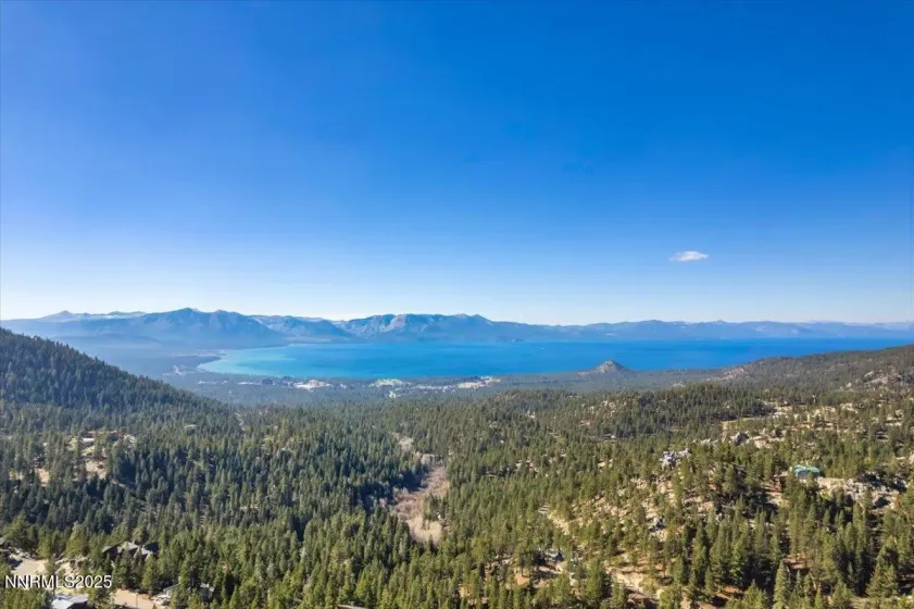 View of lake from accessible area behind unit for residents use during summer. Great fireworks view!