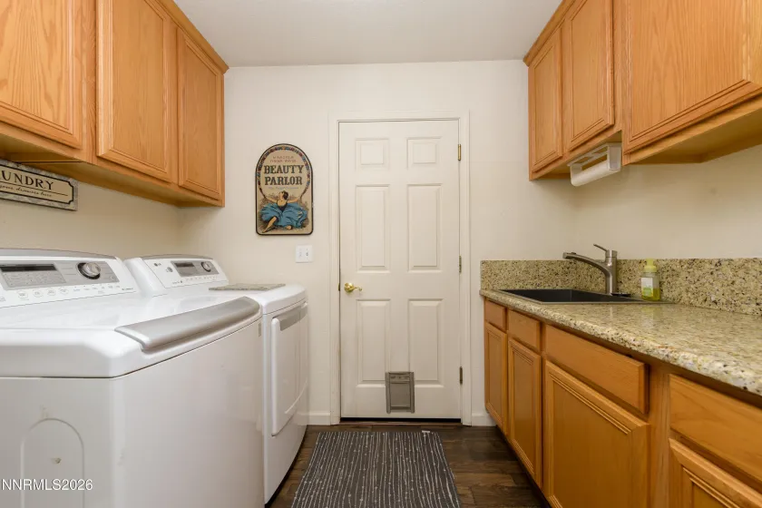 Laundry room leading into garage